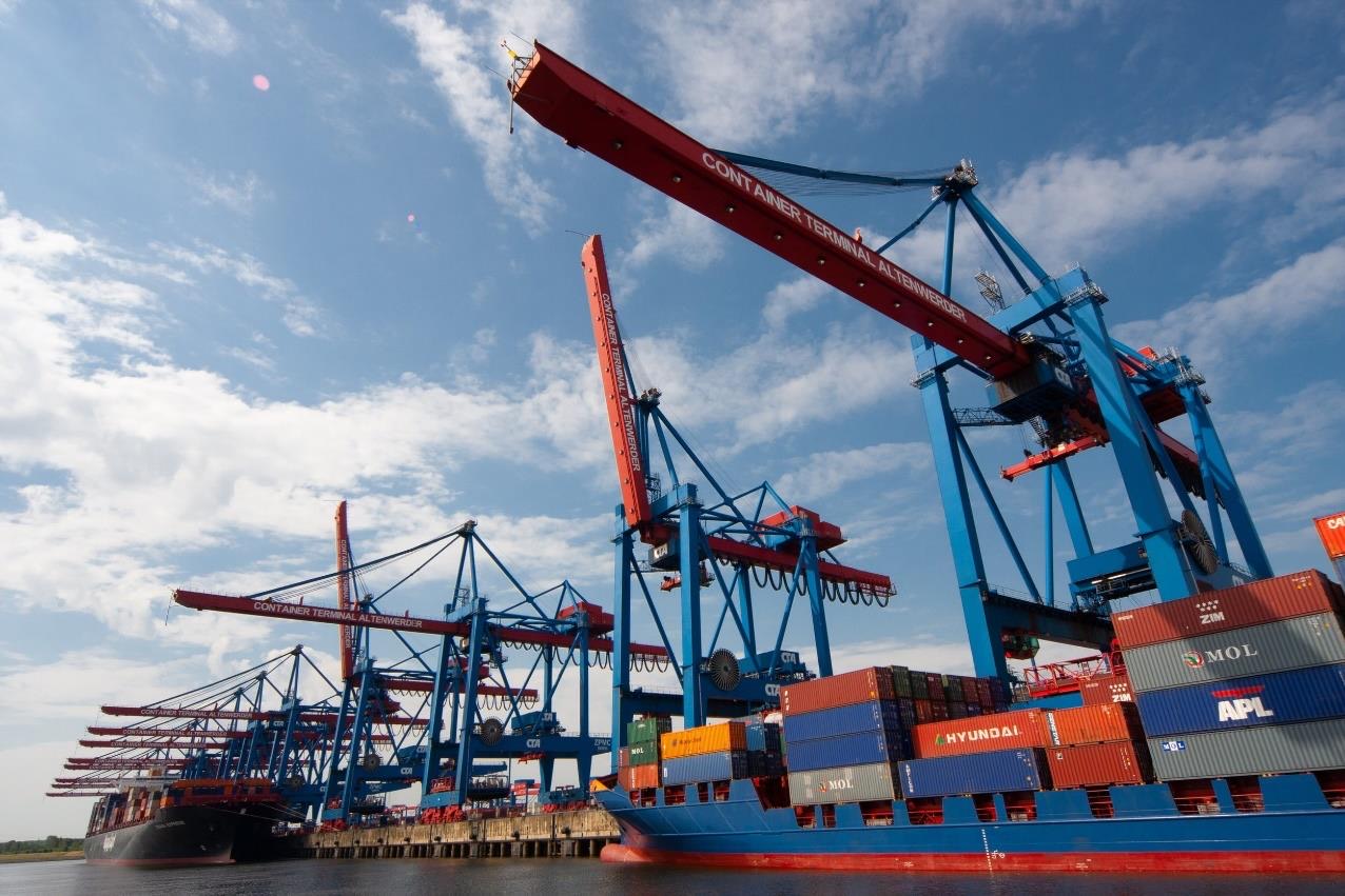 Container cranes loading a cargo ship at port